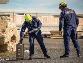 Photo of men setting equipment. 